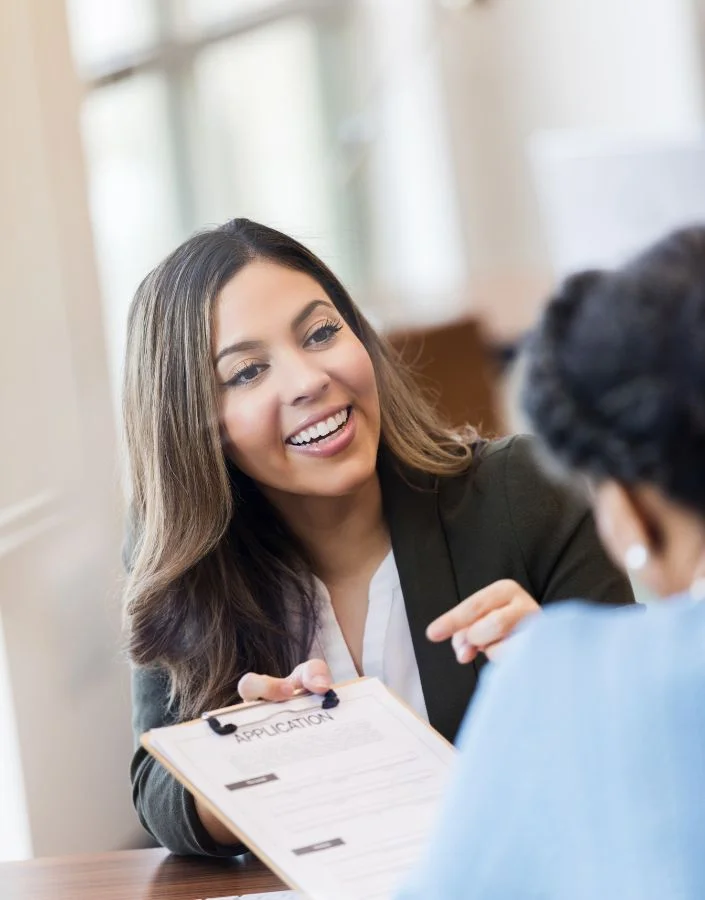 bank-officer-shows-loan-application-to-client