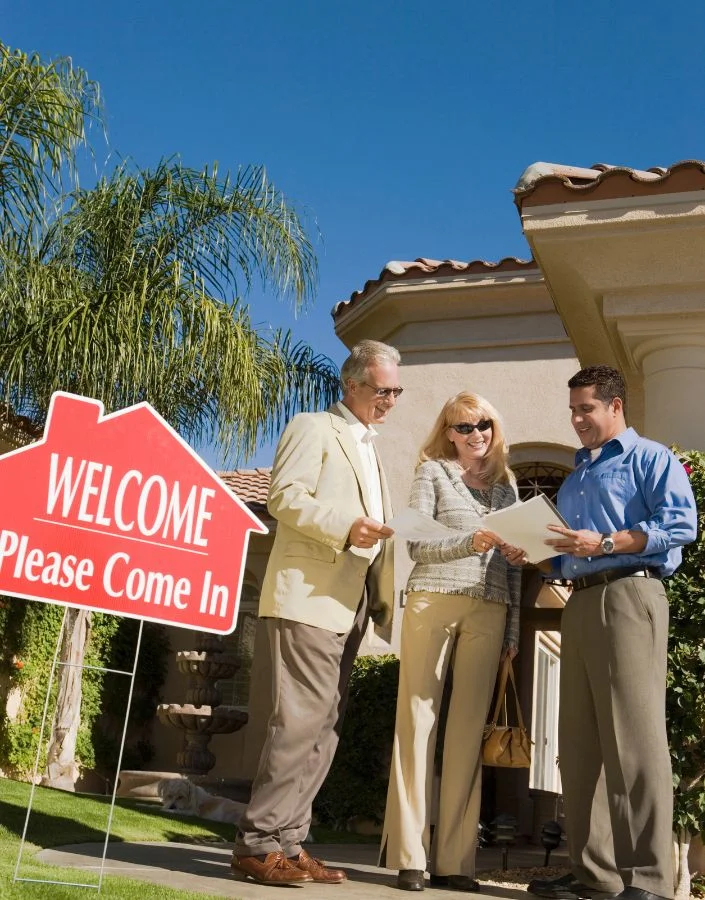 real-estate-agent-discussing-contract-with-couple