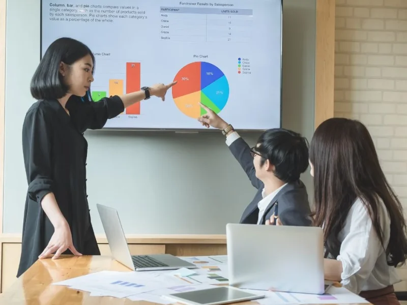 group-of-people-discussing-data-on-monitor-screen