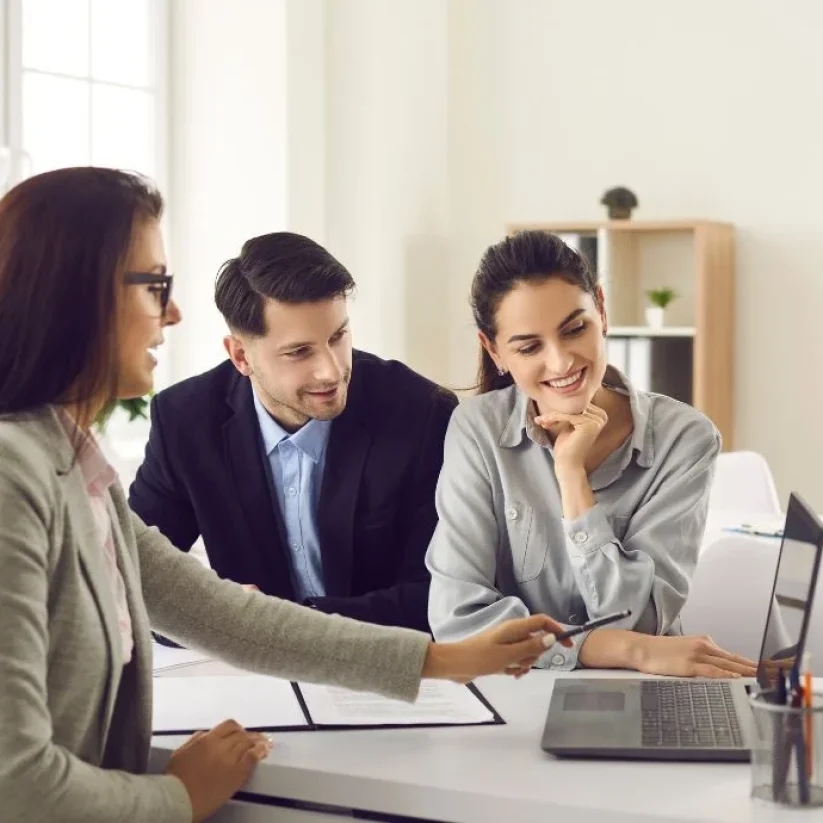 happy-couple-meeting-professional-real-estate-agent