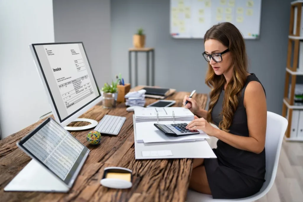 Accountant Calculating Tax At Desk 1024x683