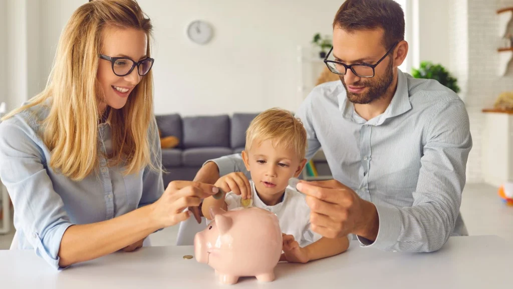 Curious Little Kid Saving Up Money And Learning About Financial Literacy From Young Parents