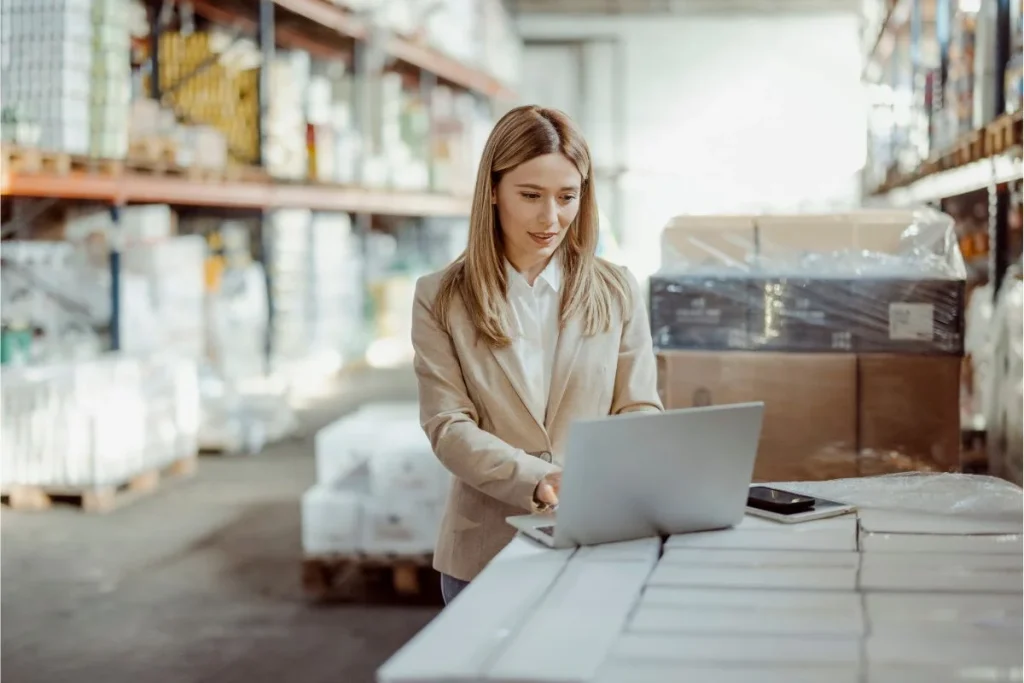 female inventory manager using laptop