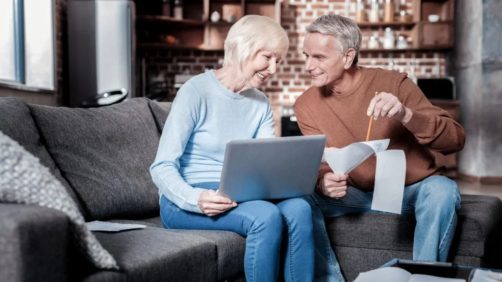 Happy Couple Counting Their Pension 1024x577