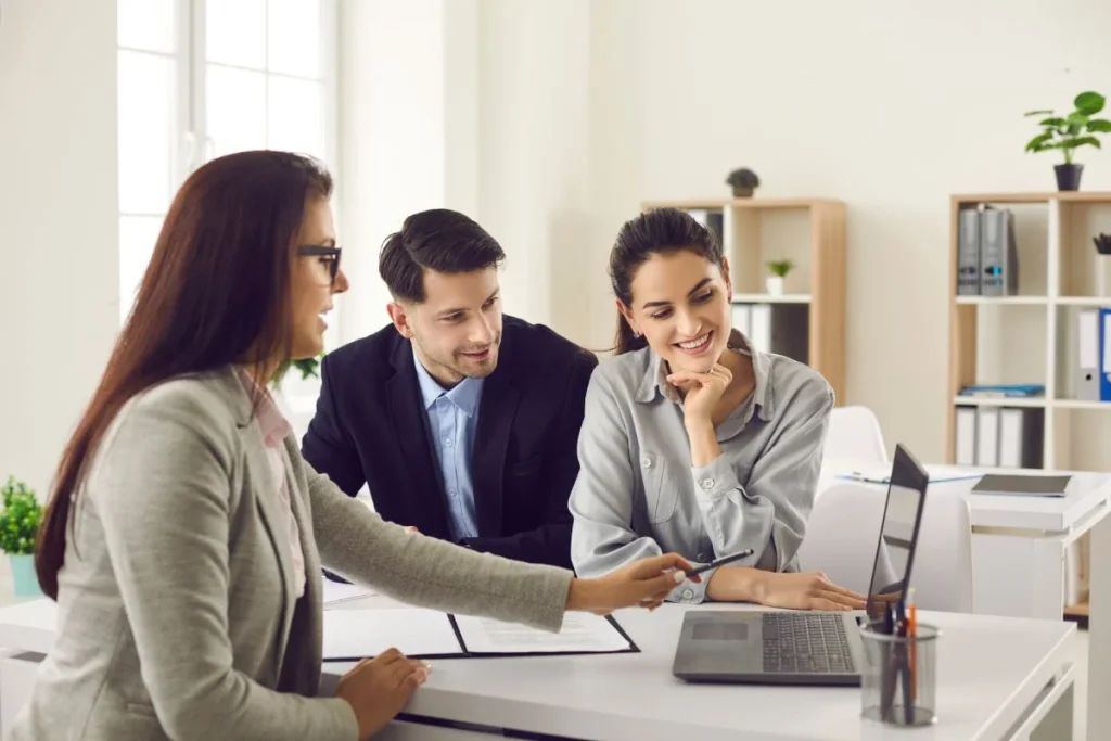 happy couple meeting professional caveat loan broker