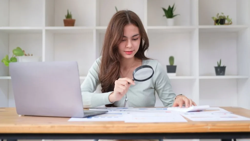 Investigator Or Auditor Checking Financial Documents 1024x577