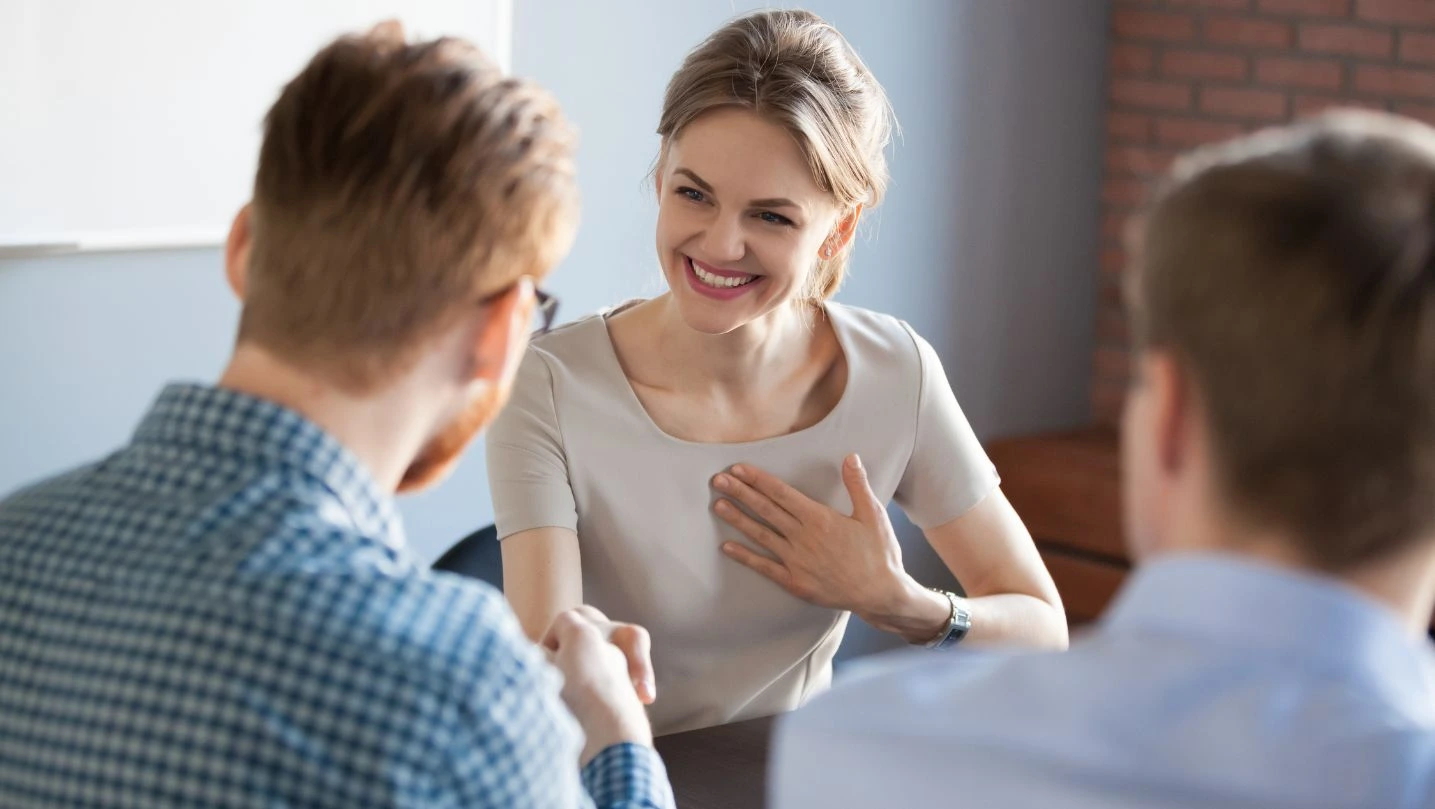 Male Employer Handshaking Female Colleague Greeting With Success