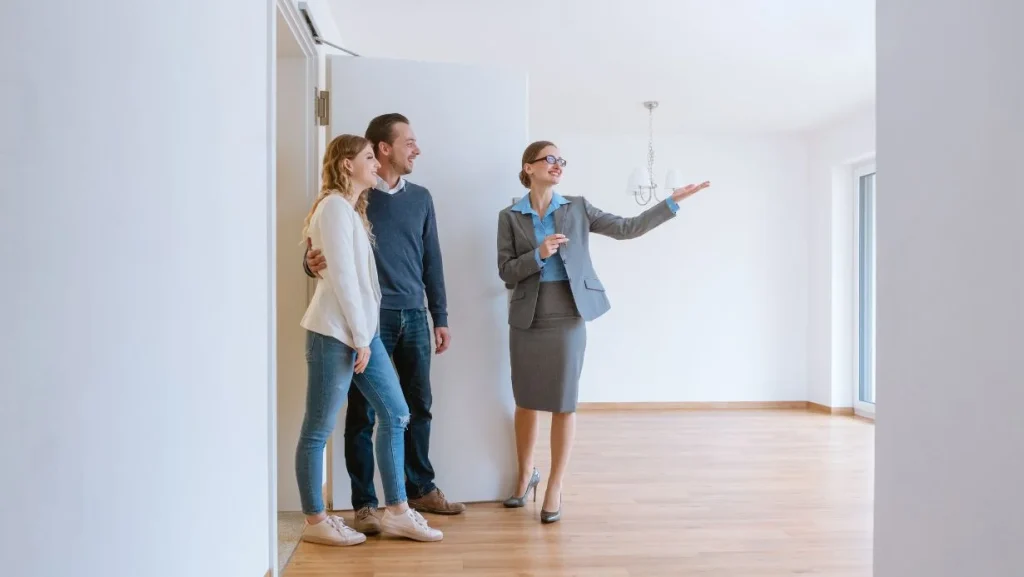 Realtor Showing House To A Young Couple 1024x577