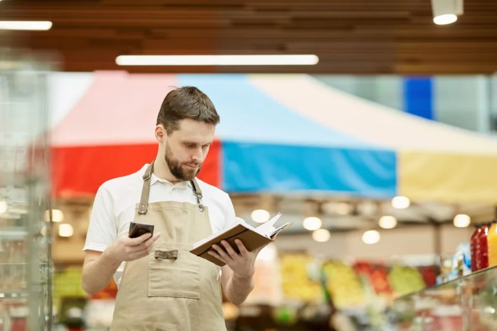 Supermarket Worker Calling Supplier 1024x683