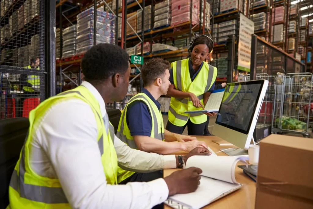 Team Discussing Warehouse Logistics In An On Site Office 1024x683