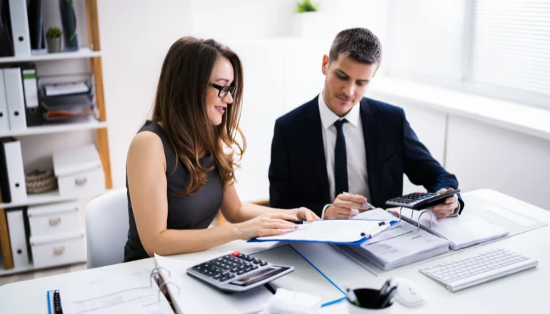 Two Business People Doing Finance Work