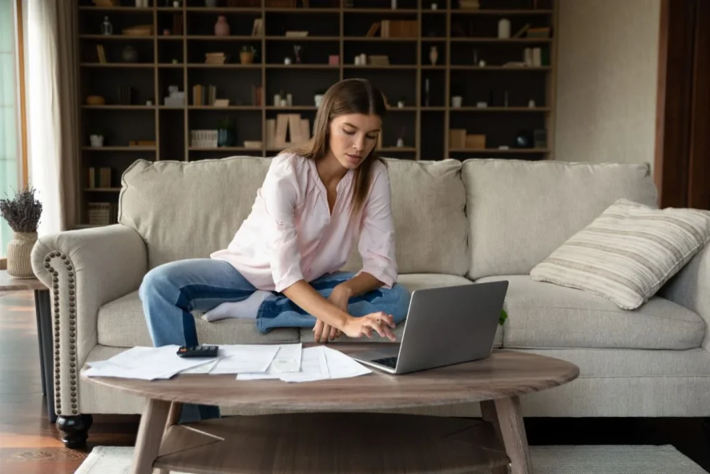 Woman Calculating Domestic Monthly Budget 1024x683