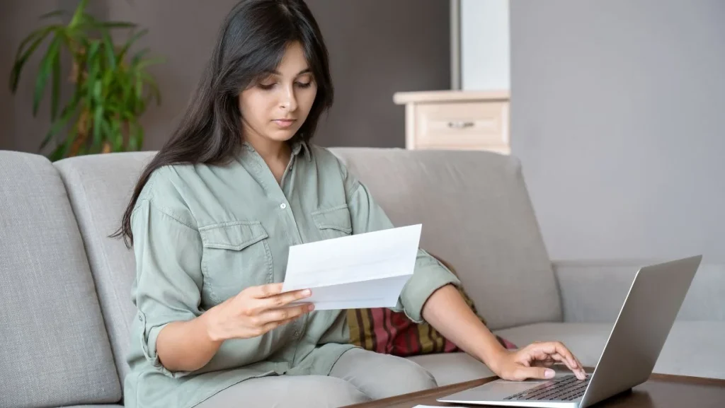 Woman Paying Bills Online At Home 1024x577