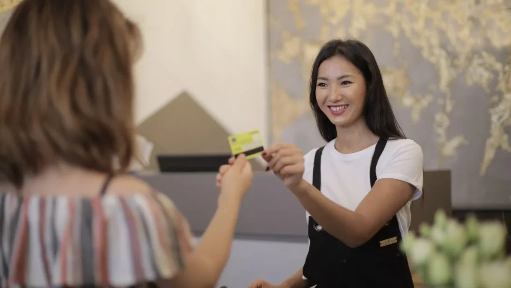 Woman Paying With Credit Card 1024x577