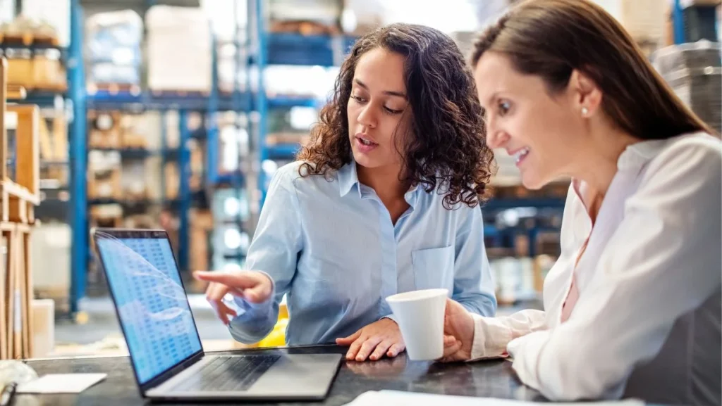 Woman Showing Inventory On Laptop To Warehouse Manager 1024x577