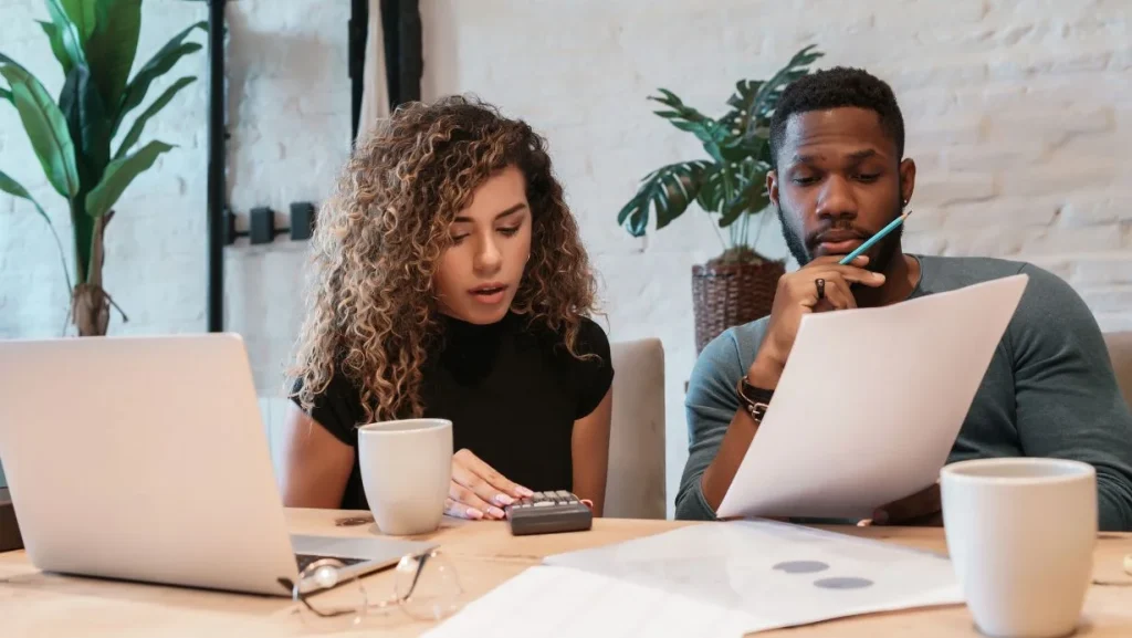 Young Couple Planning Monthly Budget Together 1024x577