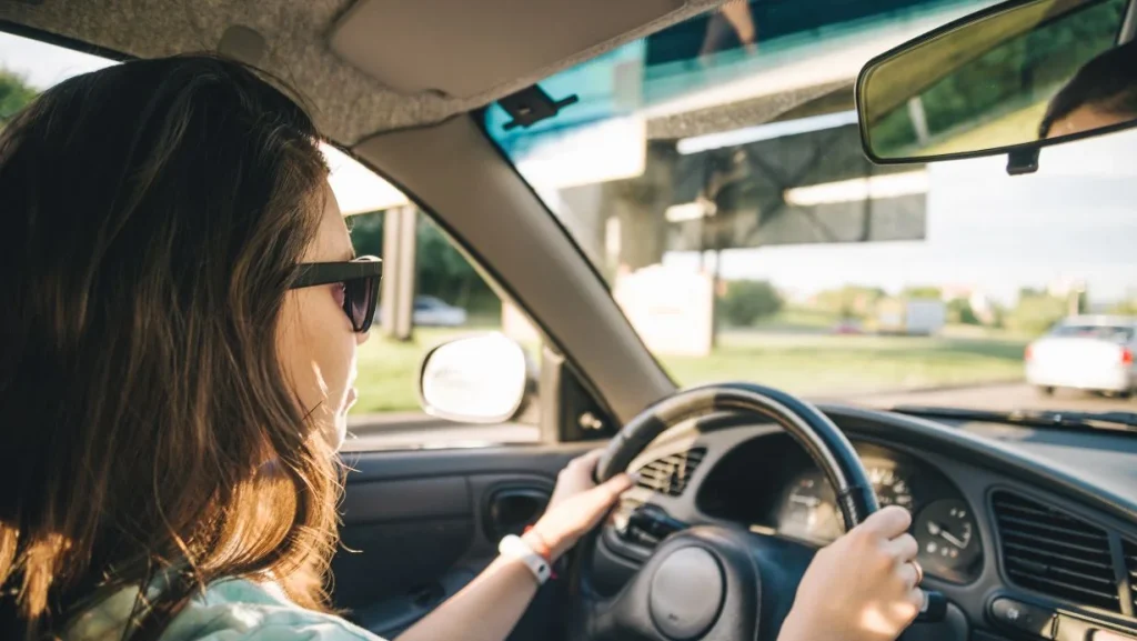 Young Woman Driving Car 1024x577