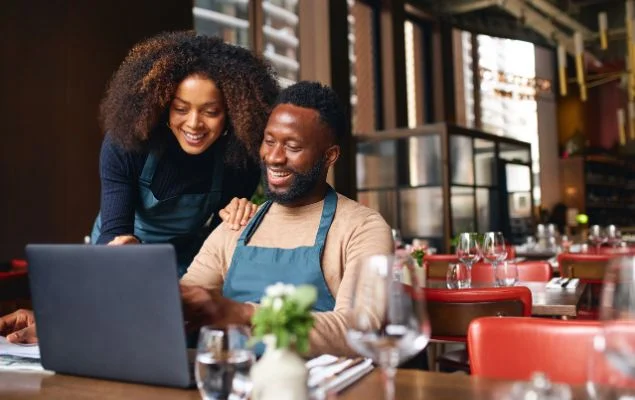 Business Owner Using Laptop