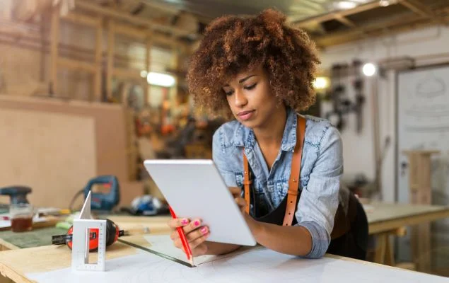 Woman Using Tablet In Her Work